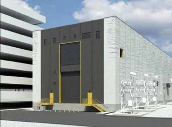 Industrial building with a large bay door, adjacent to a multilevel parking structure. Cloudy sky in the background, perfect for planning electric utilities projects using MicroStation. | Bentley Systems | Infrastructure Engineering Software Company Industrial building with a large bay door, adjacent to a multilevel parking structure. Cloudy sky in the background, perfect for planning electric utilities projects using MicroStation.