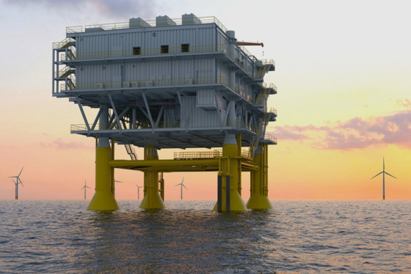An offshore oil platform stands in the ocean at sunset, with several wind turbines visible in the background, capturing a perfect scene for your next SACS brochure. | Bentley Systems | Infrastructure Engineering Software Company An offshore oil platform stands in the ocean at sunset, with several wind turbines visible in the background, capturing a perfect scene for your next SACS brochure.