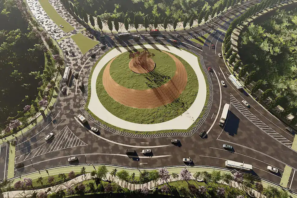 Aerial view of a large roundabout with multiple lanes, surrounding roads, and vehicles; the scene exemplifies industry leadership in urban planning. Grassy central island with a small tree in the middle.