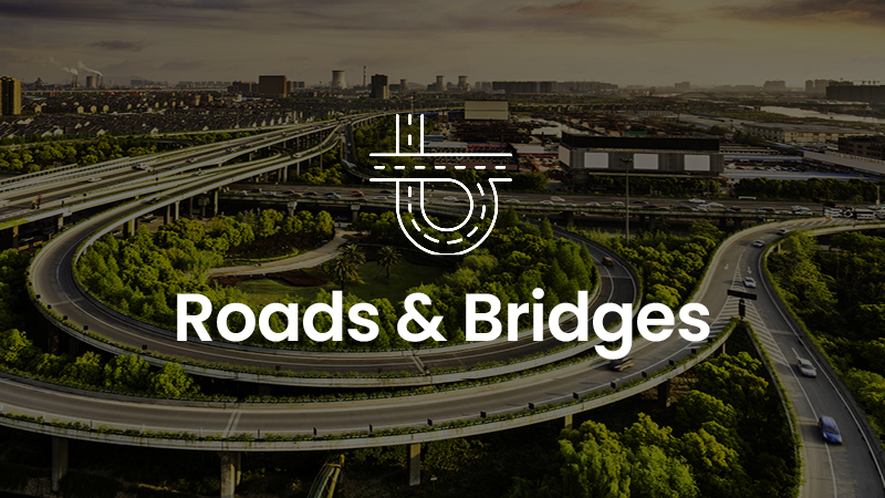 A complex highway interchange surrounded by greenery and urban buildings at sunset, overlaid with the text "Powering Transportation" and a road-related icon. Discover more about these infrastructural marvels in our latest eBook inspired by MicroStation designs.