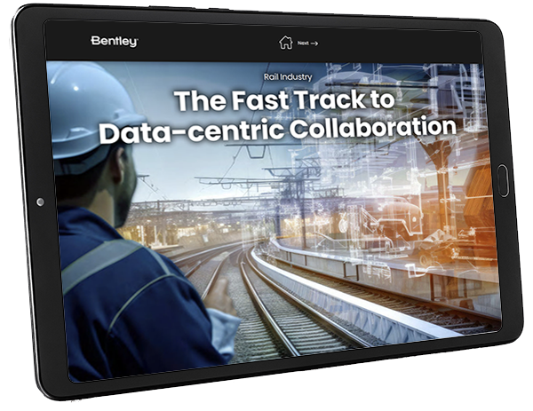 Worker viewing a digital presentation on the tablet about data-centric collaboration in the rail industry through Discover ProjectWise. | Bentley Systems | Infrastructure Engineering Software Company Worker viewing a digital presentation on the tablet about data-centric collaboration in the rail industry through Discover ProjectWise.