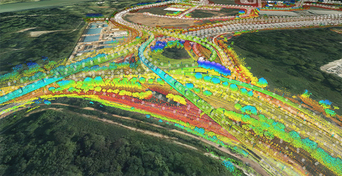 Aerial view of a highway interchange overlaid with colorful LiDAR point cloud data, easily managed and extracted using iTwin Capture tools. | Bentley Systems | Infrastructure Engineering Software Company Aerial view of a highway interchange overlaid with colorful LiDAR point cloud data, easily managed and extracted using iTwin Capture tools.